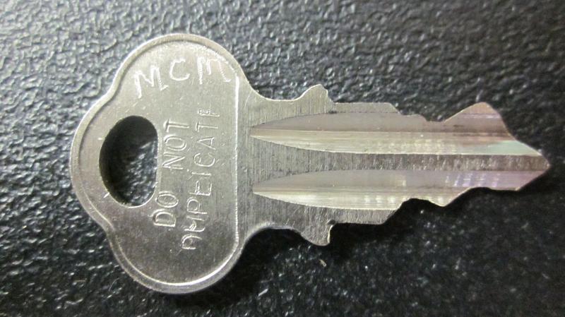 Top key for Parking meters with a lock that is stamped POM 
